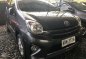 2015 Toyota WIgo 1.0 G Manual Gray Sedan-0