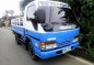 2013 Isuze Elf DropSide 10ft. Single Tire-0