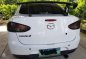 Mazda 2 2010 15 AT White Sedan for sale-0