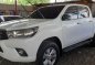 Selling White Toyota Hilux 2016 at 8800 km in Quezon City-1