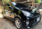 Selling Black Toyota Wigo 2014 Hatchback in Quezon City-0