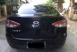 Black Mazda 2 2010 Sedan at 134000 km for sale-1