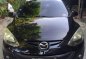 Black Mazda 2 2010 Sedan at 134000 km for sale-0