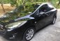Black Mazda 2 2010 Sedan at 134000 km for sale-5