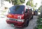 Red Nissan Urvan 2010 for sale in Pagsanjan-0