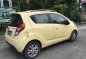 Yellow Chevrolet Spark 2013 Hatchback for sale in Manila -1