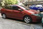 Red Honda City 2009 at 94000 km for sale -0