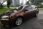 Sell Brown 2014 Toyota Corolla Altis Automatic Gasoline -1