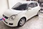 White Suzuki Swift 2010 at 61817 km for sale-0