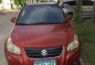 Orange Suzuki Sx4 2014 at 65000 km for sale in Manila-0