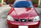 Red Chevrolet Optra 2004 for sale in Manual-0