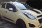 Selling Cream Chevrolet Spark 2014 in Pili-0