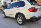 White Bmw X5 2009 at 61000 km for sale -3