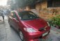 Red Honda City 2005 at 95000 km for sale -0