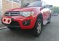 Sell Red 2013 Mitsubishi Strada in Quezon City -1