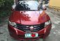 Red Honda City 2009 at 97000 km for sale -0