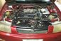Red Mazda 323 1999 at 100000 km for sale-1
