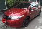 Red Honda City 2009 at 97000 km for sale -1