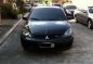 Sell Black 2009 Mitsubishi Lancer in Quezon City-0