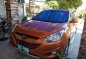 Selling Orange Hyundai Tucson 2013 in San Pascual-1