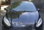Black Ford Fiesta 2014 at 64000 km for sale -1