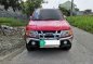 Red Isuzu Sportivo 2010 for sale in Baliuag-1