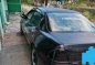 Black Mazda Protege for sale in Dau-2