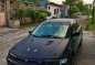 Black Mazda Protege for sale in Dau-0
