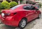 Red Mazda 2 for sale in Pacita Complex-1