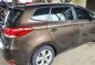 Brown Kia Carens for sale in Butuan-6