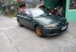 Green Mazda 323 for sale in Bulacan-1