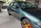 Green Mazda 323 for sale in Bulacan-1