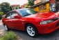 Red Mitsubishi Lancer for sale in Quezon City-0