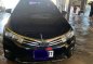 Selling Black Toyota Corolla Altis 2014 in Gapan-0