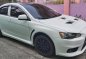 Pearl White Mitsubishi Lancer 2010 for sale in Quezon City-1