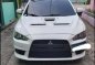 Pearl White Mitsubishi Lancer 2010 for sale in Quezon City-7