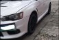 Pearl White Mitsubishi Lancer 2010 for sale in Quezon City-8