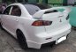 Pearl White Mitsubishi Lancer 2010 for sale in Quezon City-2