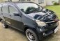 Selling Black Toyota Avanza 2014 in Taal-0