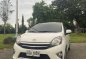 Pearl White Toyota Wigo 2014 for sale in Quezon City-0