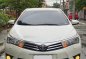 Sell Pearl White 2014 Toyota Corolla Altis -0