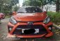 Selling Orange Toyota Wigo 2021 in Quezon City-1