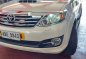 Pearl White Toyota Fortuner 2014 for sale in Lucena-0