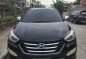 Selling Black Hyundai Santa Fe 2015 in Cebu -1