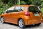 Orange Honda Jazz 2013 for sale in Las Piñas-9